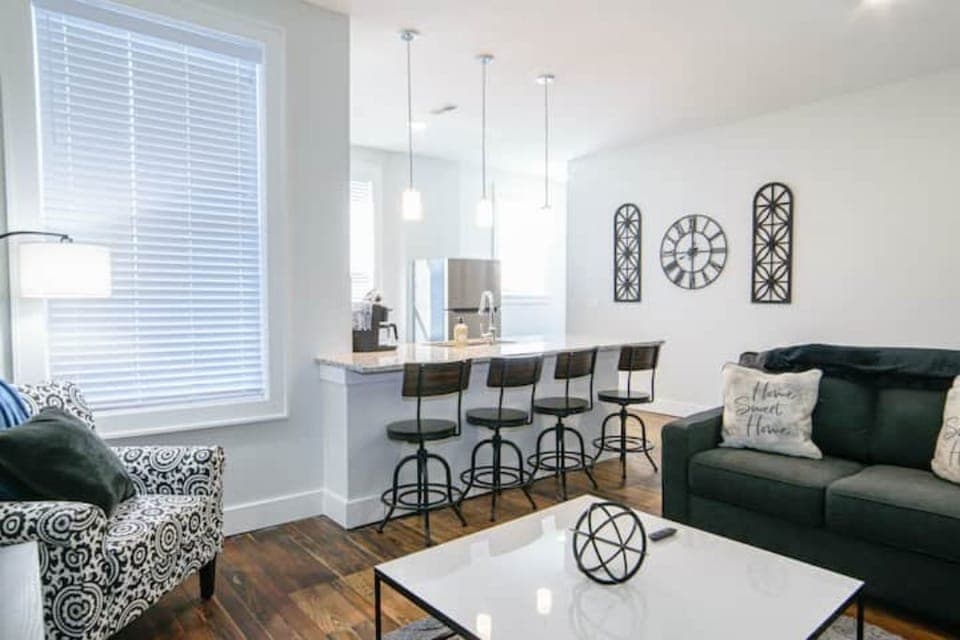 Open concept kitchen, dining, and living space in unit #5