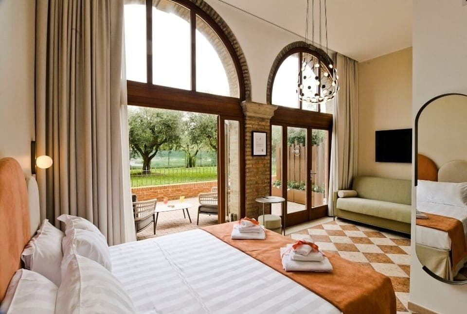 Elite Room, Patio, Garden View (Olivia) | Down comforters, minibar, in-room safe, blackout drapes