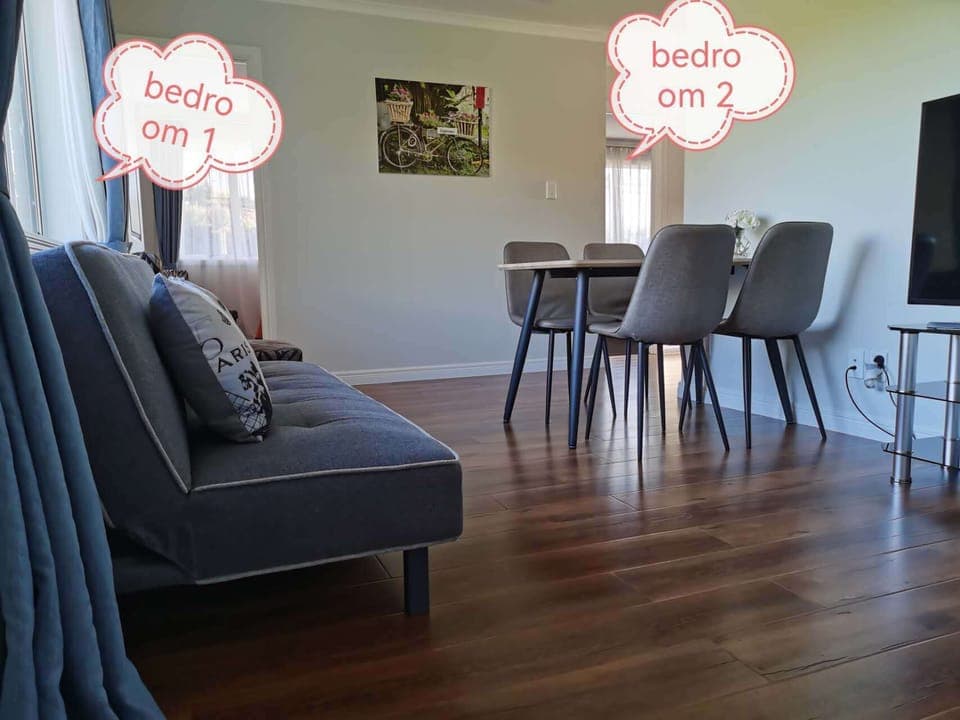 livingroom with TV and sofe,connect to two bed room,bathroom and kitchenette.