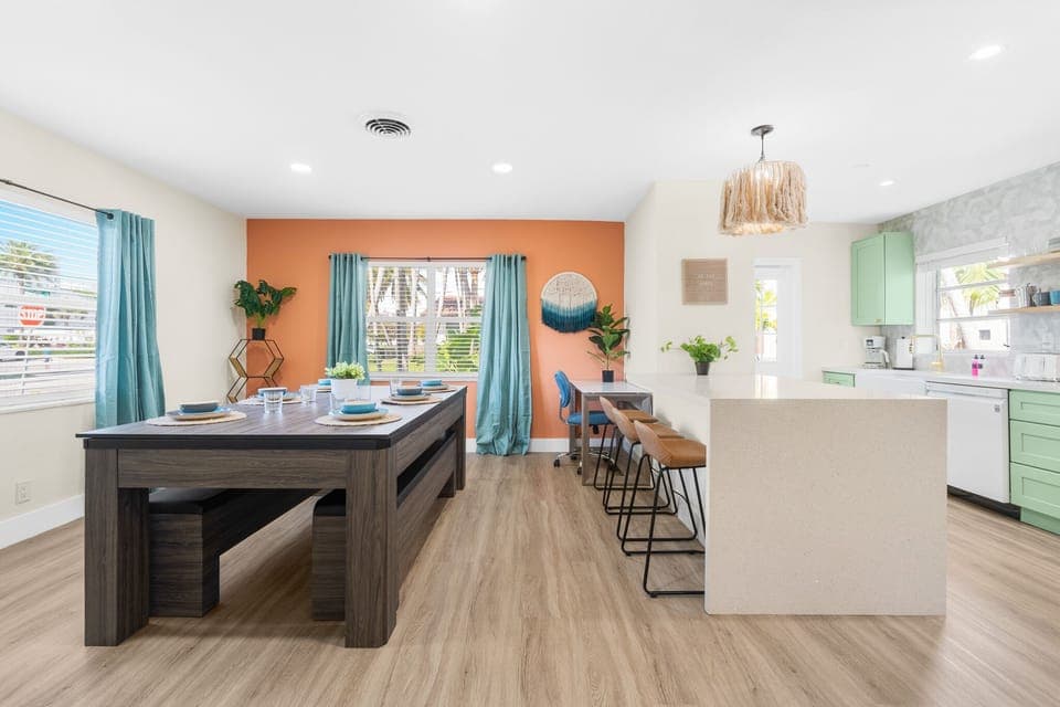 Cook, eat, and play—all in one spot. The dining table’s double duty keeps everyone entertained.