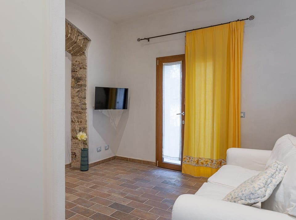 Condo | Living room | 32-inch LCD TV with satellite channels, TV