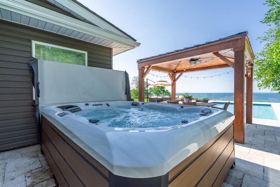 Unwind in the hot tub and watch the sunset over Lake Erie.
