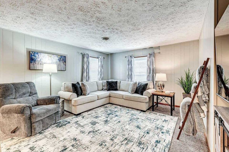 Living room with large smart tv and fireplace