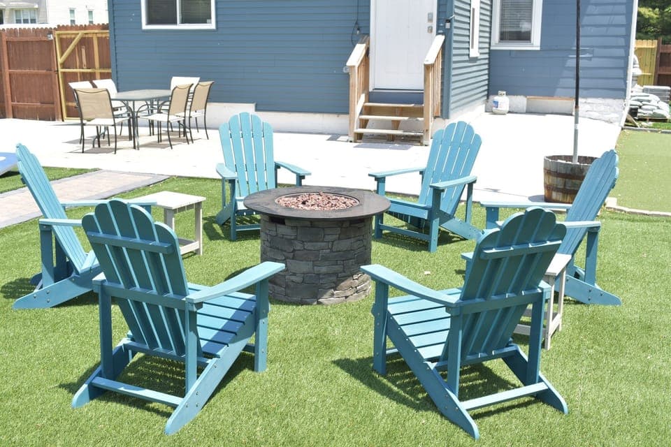 Make memories around the gas firepit with Adirondack-chair seating for 6.