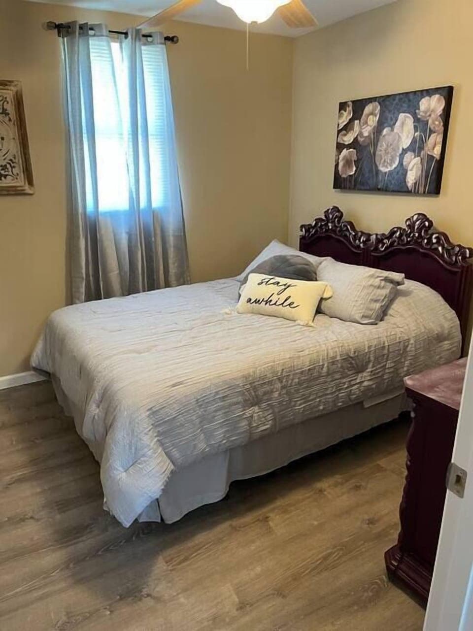 Queen size bed with fan.