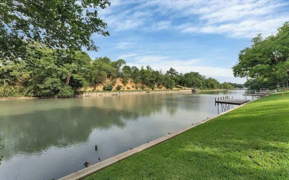Lake McQueeny is a reservoir located on the Guadalupe River between New Braunfels and Seguin. Lake level has been lowered. Picture shows current level. No motorized boating allowed at this time. No Lifeguard on Duty. No Diving. Life jackets available