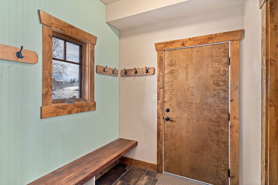 Features a bench and coat hooks