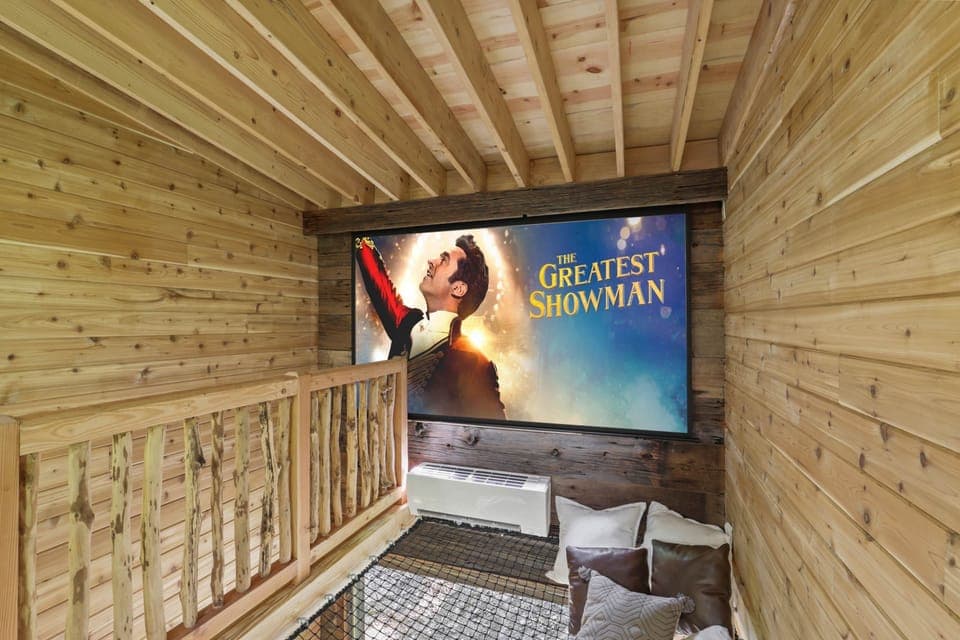 The large projection screen in the loft is the best place to watch a movie