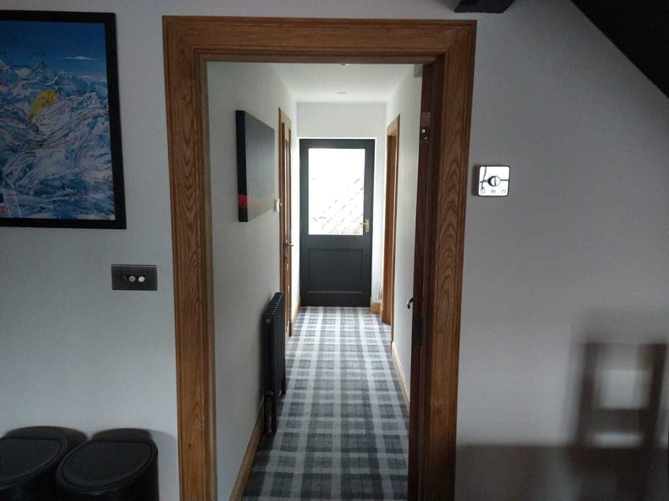 Hall leading to downstairs "suite" which can be closed off for privacy