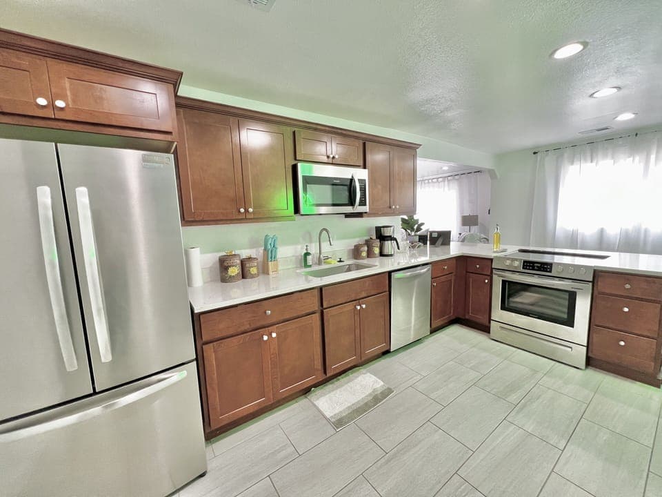 Kitchen with stainless stele appliances, coffee pot, and all of your basic needs