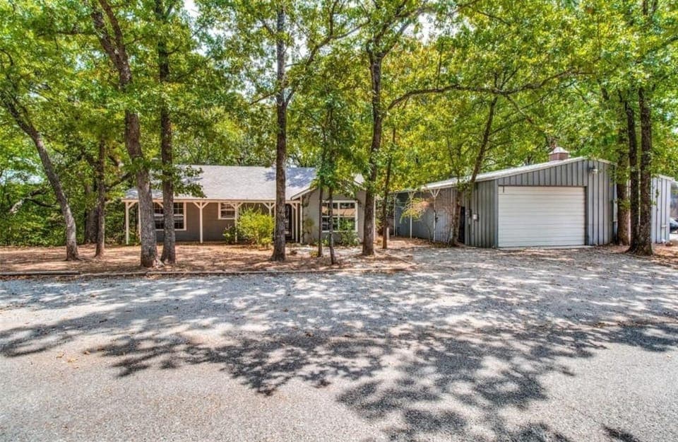 Full view of both the cottage and the cabin, showing the canopy of trees w/shade