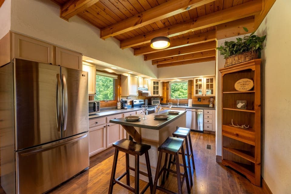 Fully equipped kitchen with seating for 3 at the bar. Features include all basics plus air fryer, 2 coffee makers, basic spices, full sized refrigerator and freezer, pancake griddle, waffle maker, kid friendly plates/cups and more. 