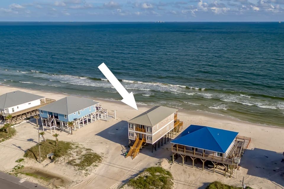 Beachfront vacation home with direct beach access, positioned perfectly between ocean waves and coastal charm.
