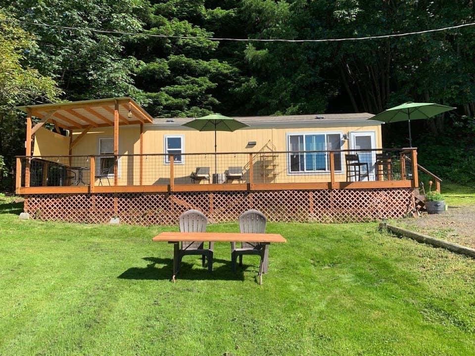 The big, new deck has plenty of space for relaxing in sun, shade, or rain. 