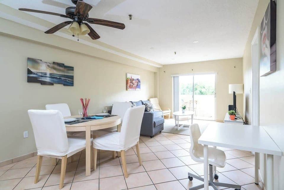 "Enjoy this bright, open-concept space! 🍽️ Perfect for your next getaway, this vacation rental features a dedicated workspace and cozy dining area. Relax in style and stay connected during your coastal staycation. ✨"