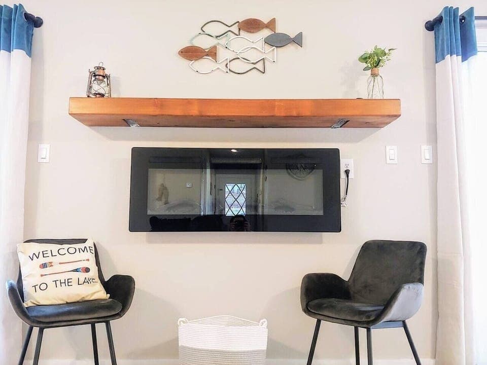 Electric fireplace in the 4-bedroom home.  Please watch the kiddos!