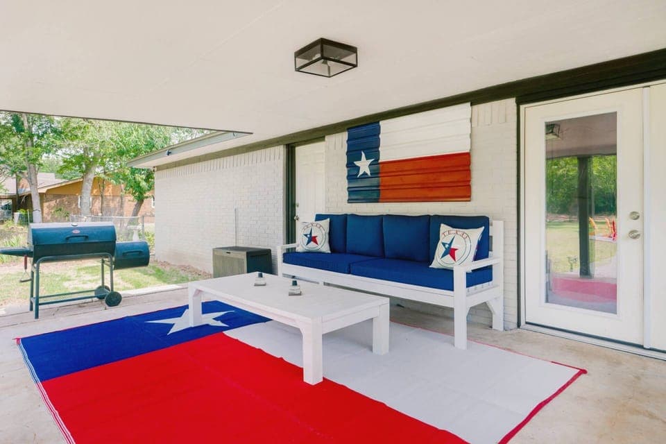 Shaded grilling with comfortable seating ensures no one cooks alone