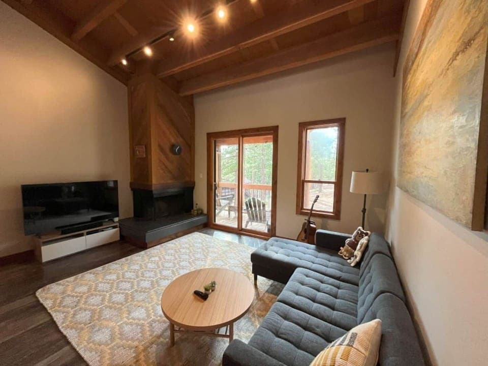 The living room has a Smart TV and balcony access. Great for entertaining and lounging after a long day of exploring!