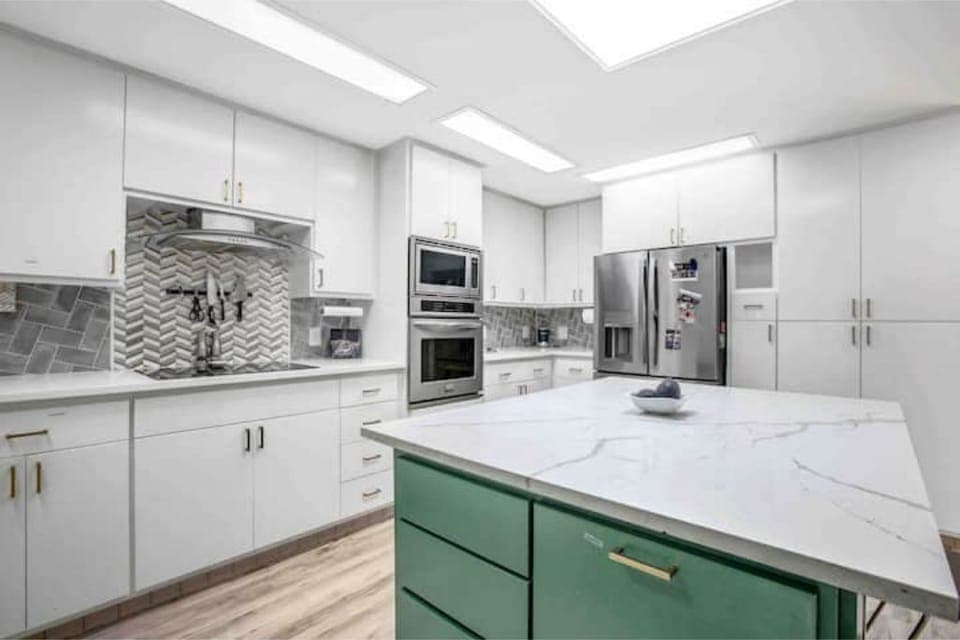 Kitchen with fully stocked appliances. Coffee machine, espresso machine, ect