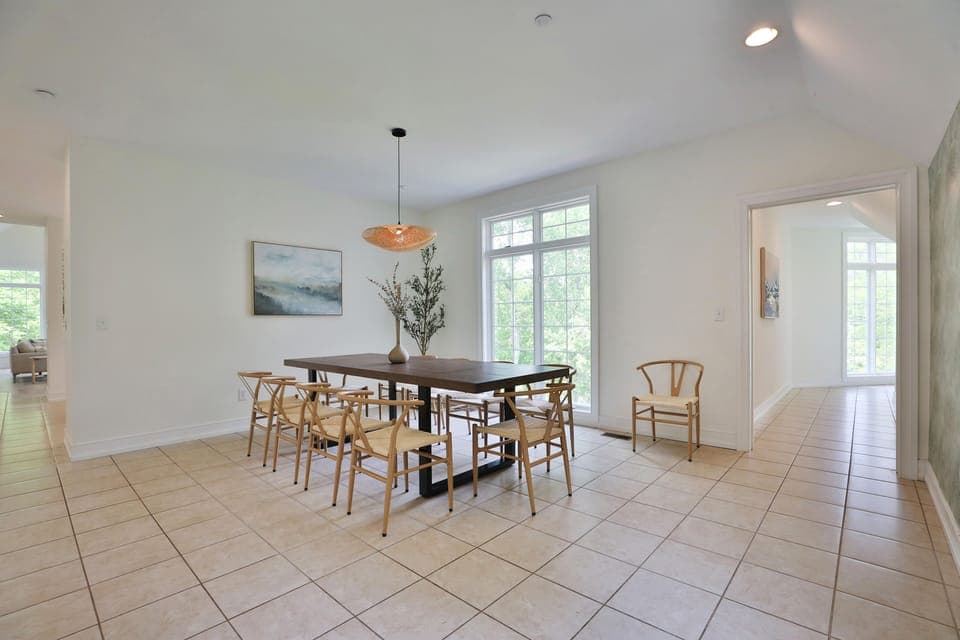 Formal dining room with large table. Addtl folding tables and chairs on property