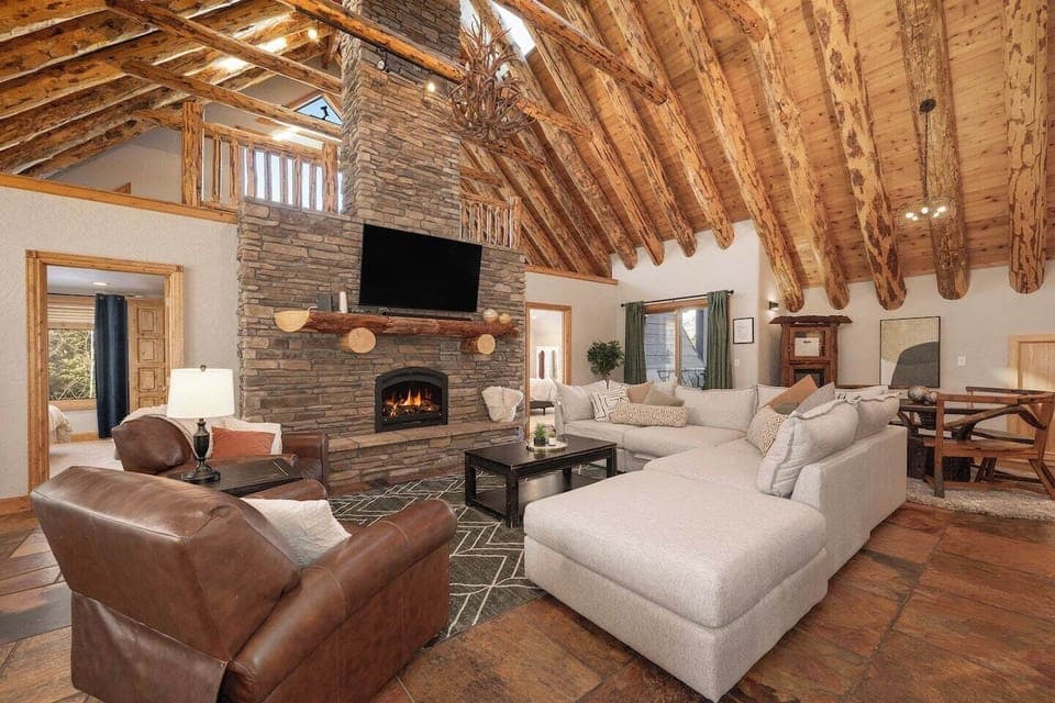 Custom wood vaulted ceilings, beautiful open floor plan, gas fireplace. Cozy up and watch a movie on our 65" HDTV 