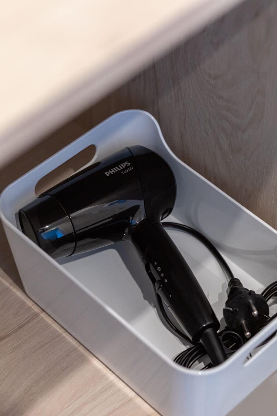 Hair dryer in the bathroom.