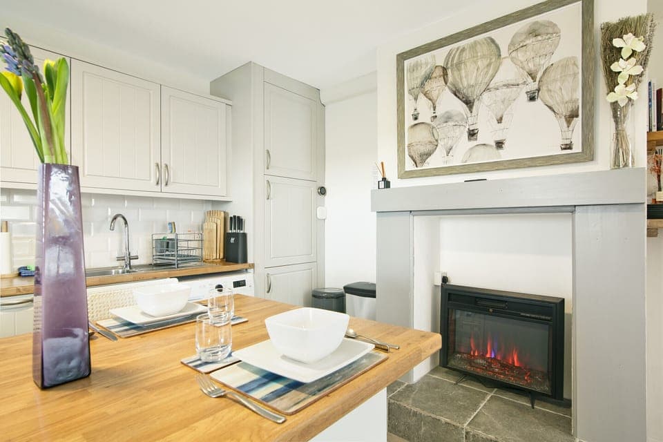 Cozy up by the fireplace in our inviting living room.