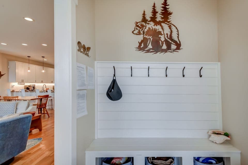 entryway with lots of hooks for hanging jackets, bags, etc.