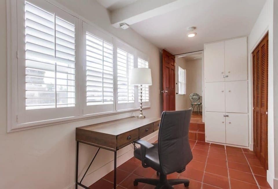 Desk with view of the drive way and patio