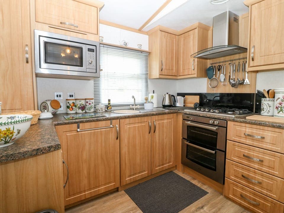 Fridge, electric kettle, cookware/dishes/utensils