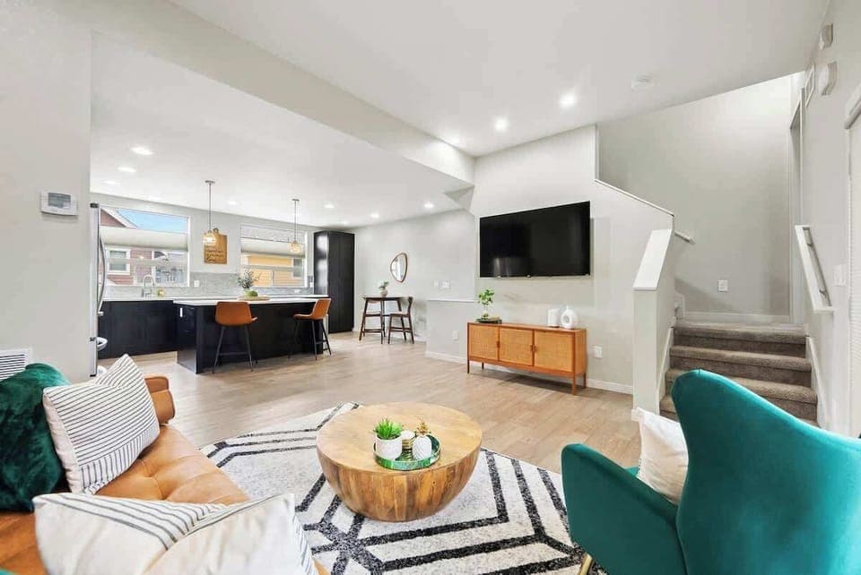 Cozy up in this beautiful living room and enjoy the view of the flat screen TV. Relax and recharge after a long day by choosing this Airbnb to be your home away from home!