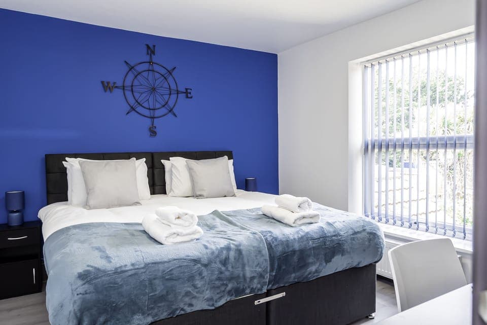Double-bed bedroom designed to ease and calm your mind with it's soothing blue background. Strategically combined with a window to give you abundant natural light during the day.