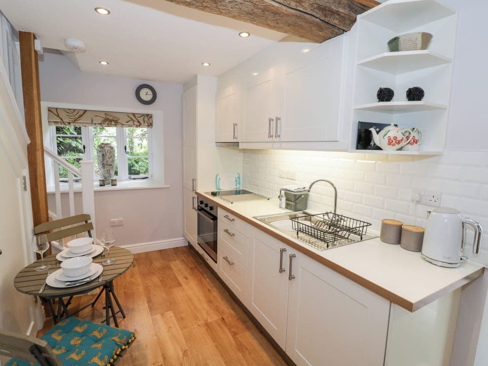 Fridge, electric kettle, cookware/dishes/utensils