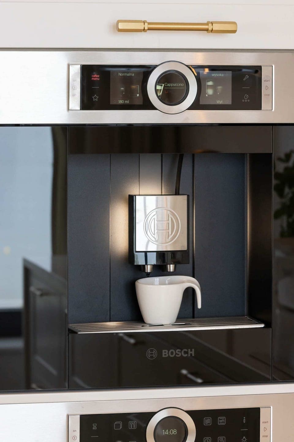 A built-in coffee machine in the kitchen, offering convenience and a sleek design.

