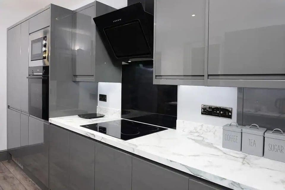 Essential appliances with white marble countertop to added touch of sophistication. 