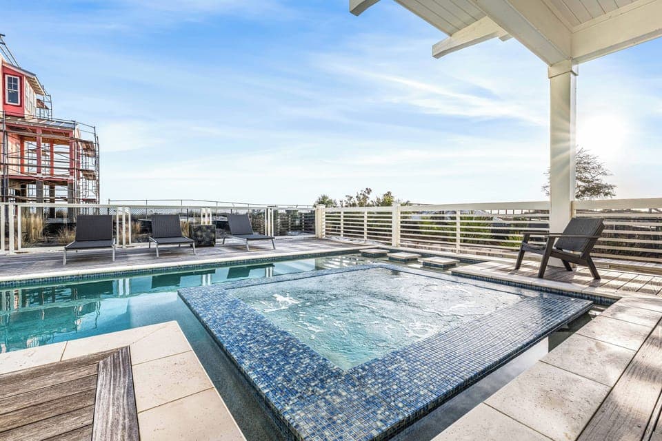 Rejuvenate in the hot tub or lounge by the pool while the sun sets over the coast