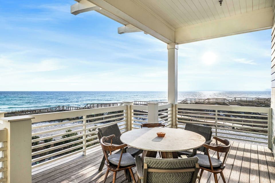 Dine at the table on this shaded porch while enjoying the vast, sun-kissed ocean views