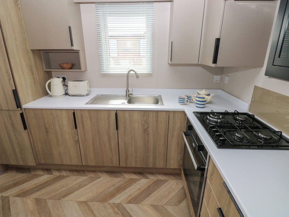 Fridge, electric kettle, cookware/dishes/utensils