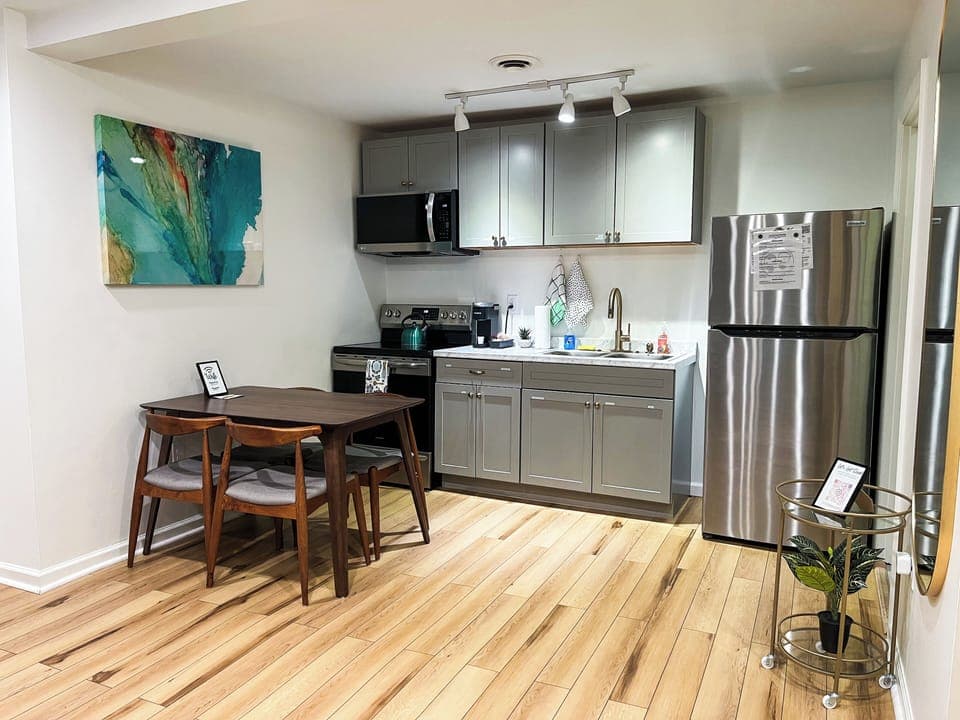 Start your mornings right with our complimentary selection of coffee and There's a coffee maker and a kettle available for your use. We've stocked the kitchen with a comprehensive set of cookware, including pots, pans, baking trays, and various cooking utensils. You'll find everything you need to whip up a feast.