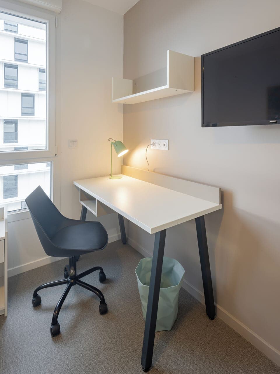 Premium bedding, desk, laptop workspace, blackout drapes