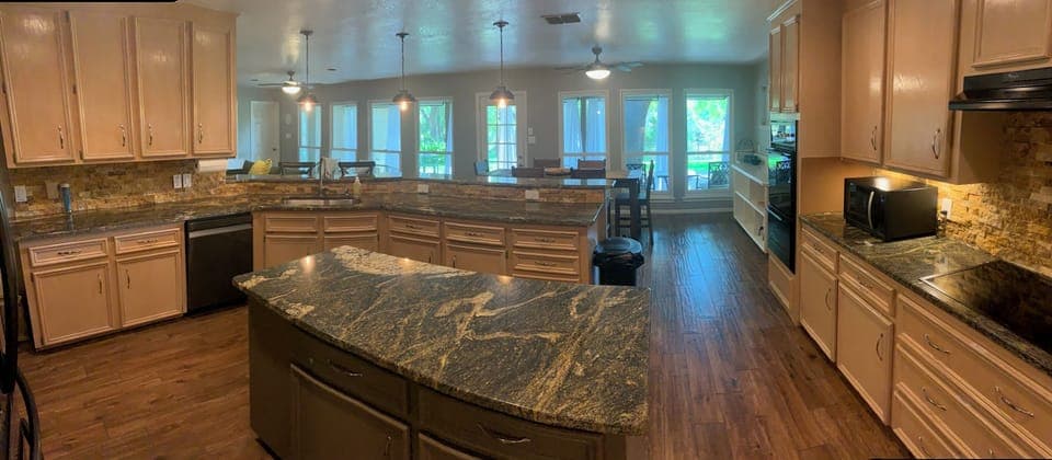 Spacious Kitchen with Island, ample counterspace and Breakfast Bar seating.