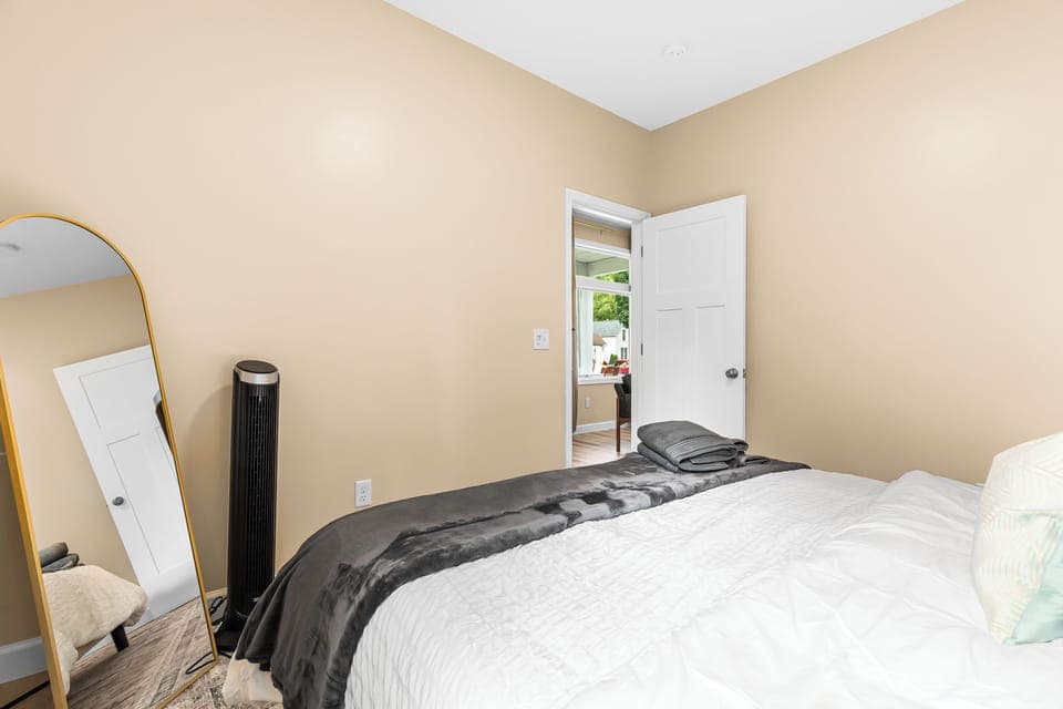 Indulge in the comfort of our king-size bed adorned with luxurious linens and pillows.