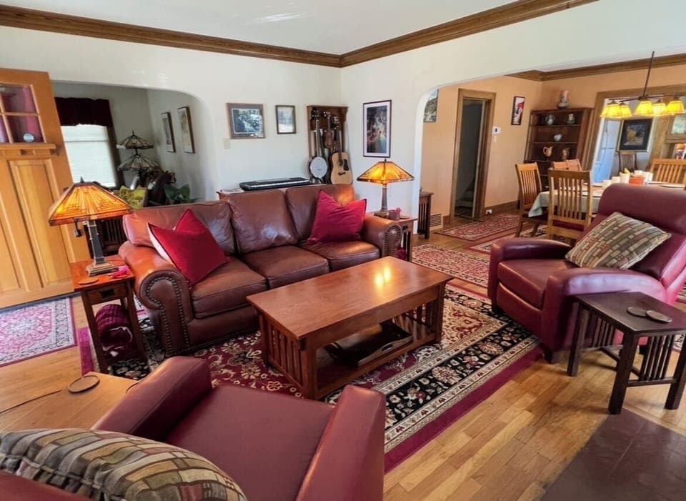 Arches, genuine leather furniture, crown molding, oriental rugs, period detail.