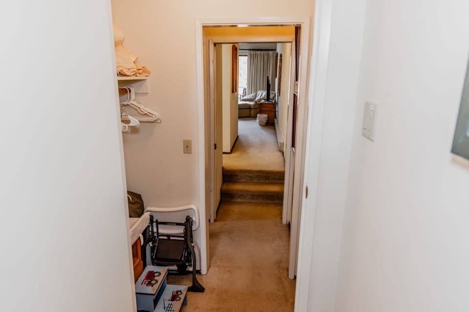 Packnplay, high chair, changing pad, and step stool stored in the upstairs hall