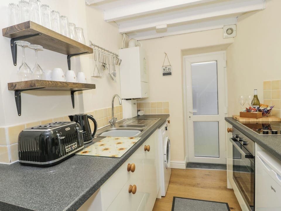 Fridge, electric kettle, toaster, cookware/dishes/utensils