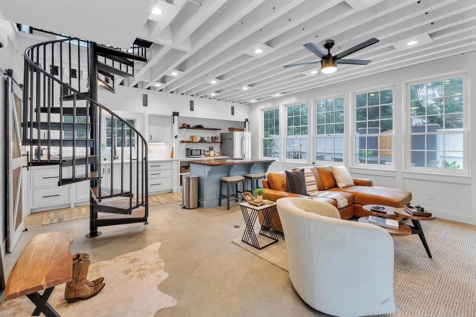 Guest house: open floor plan with spiral stairs leading to the upstairs bedroom