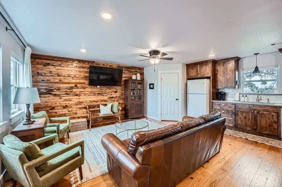 Open-concept living room with seamless flow to the kitchen and dining areas.