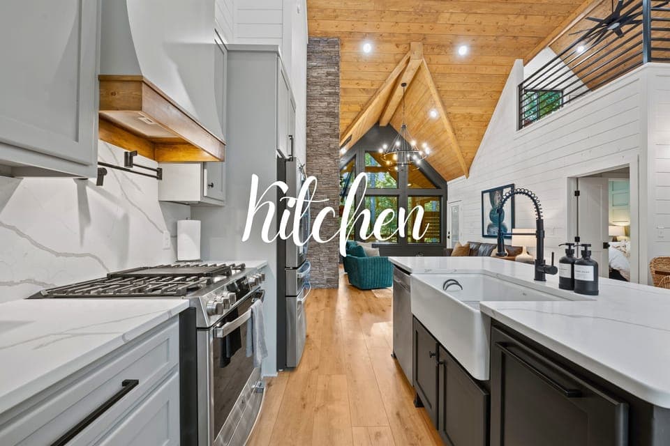 This kitchen features state-of-the-art appliances, white shaker cabinets, and a large island, perfect for meal prep and social gatherings