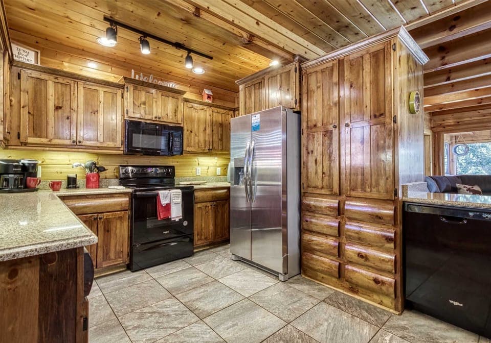  Cook up memories in this spacious, rustic kitchen with modern appliances and warm wood accents!