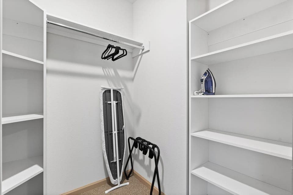 Closet with ironing board and iron